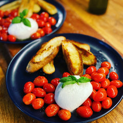 Burrata with fennel and cumin roasted cherry tomatoes.